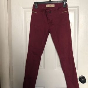HOLLISTER: low rise burgundy skinny jeans